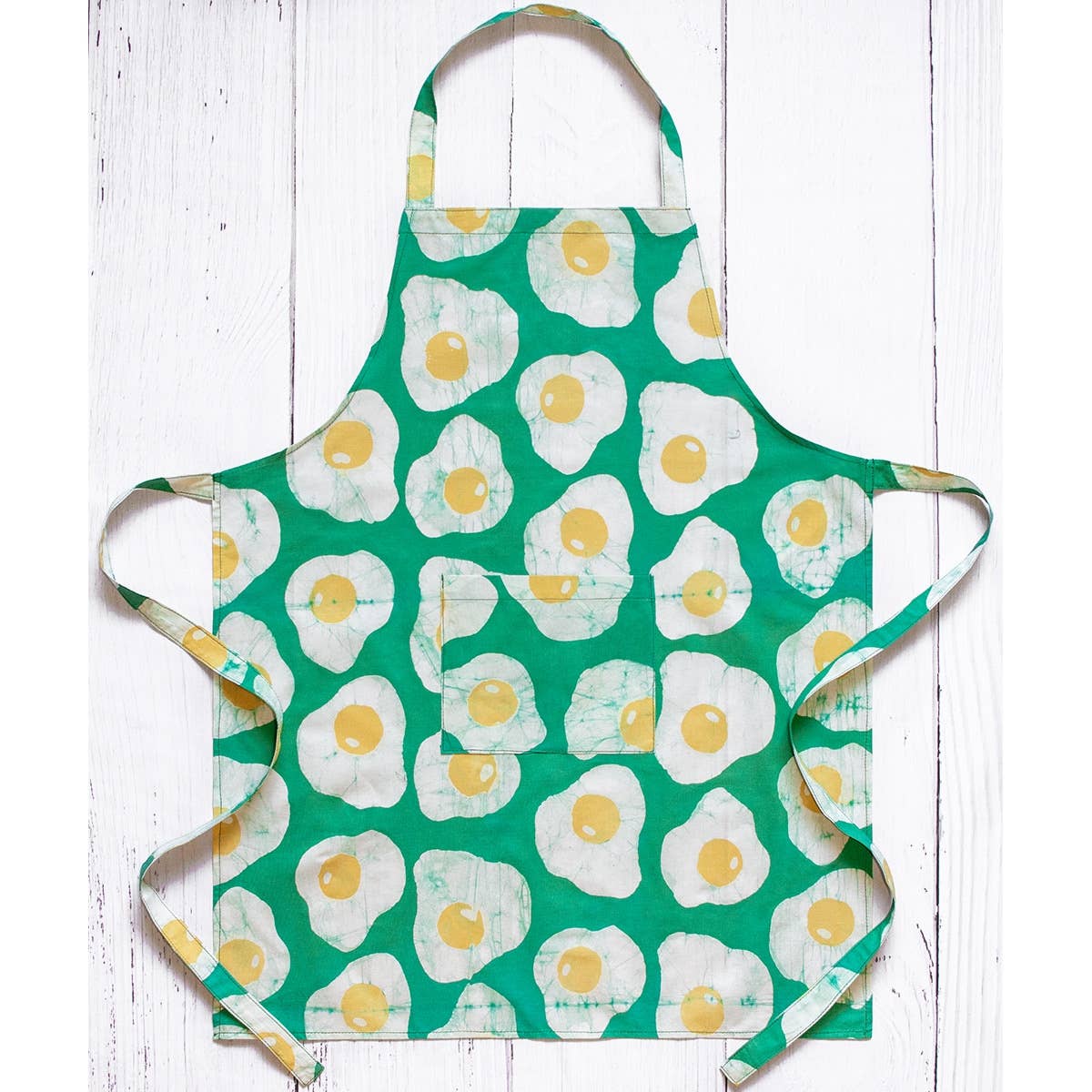 Reversible organic batik apron from Global Mamas featuring vibrant patterns and a comfortable fit for kitchen or craft use.