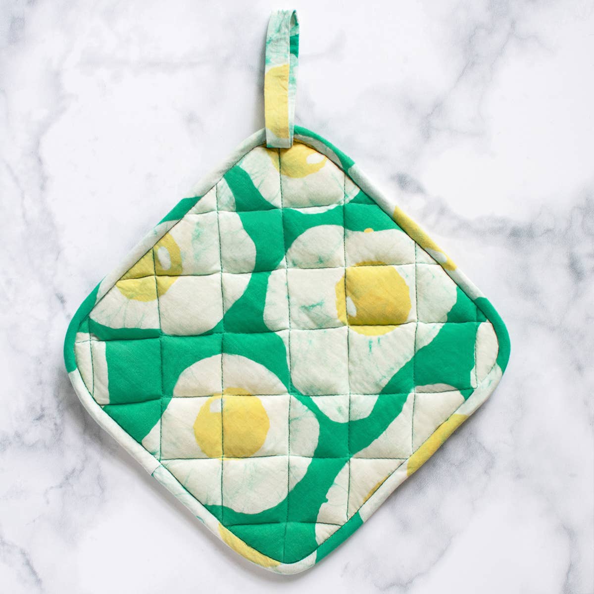 Organic Batik Pot Holder with egg pattern from Global Mamas, featuring colorful, hand-dyed fabric and traditional batik design.