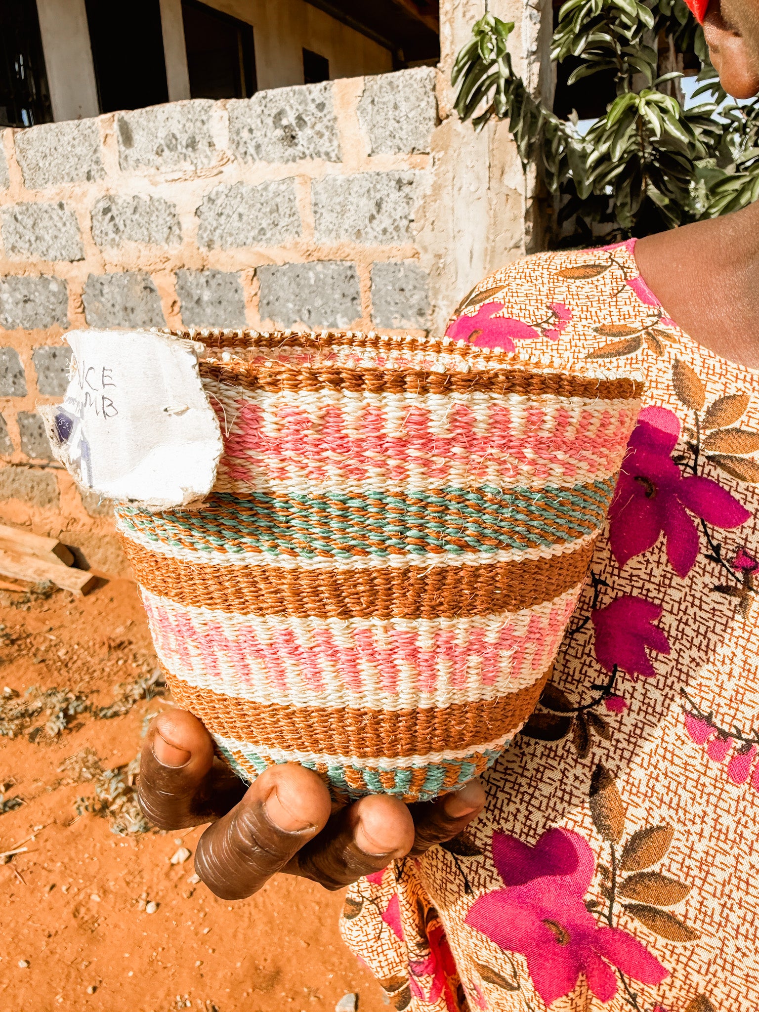 Hadithi fine weave sisal basket with sturdy handles and natural fibers, ideal for storage or home decoration.