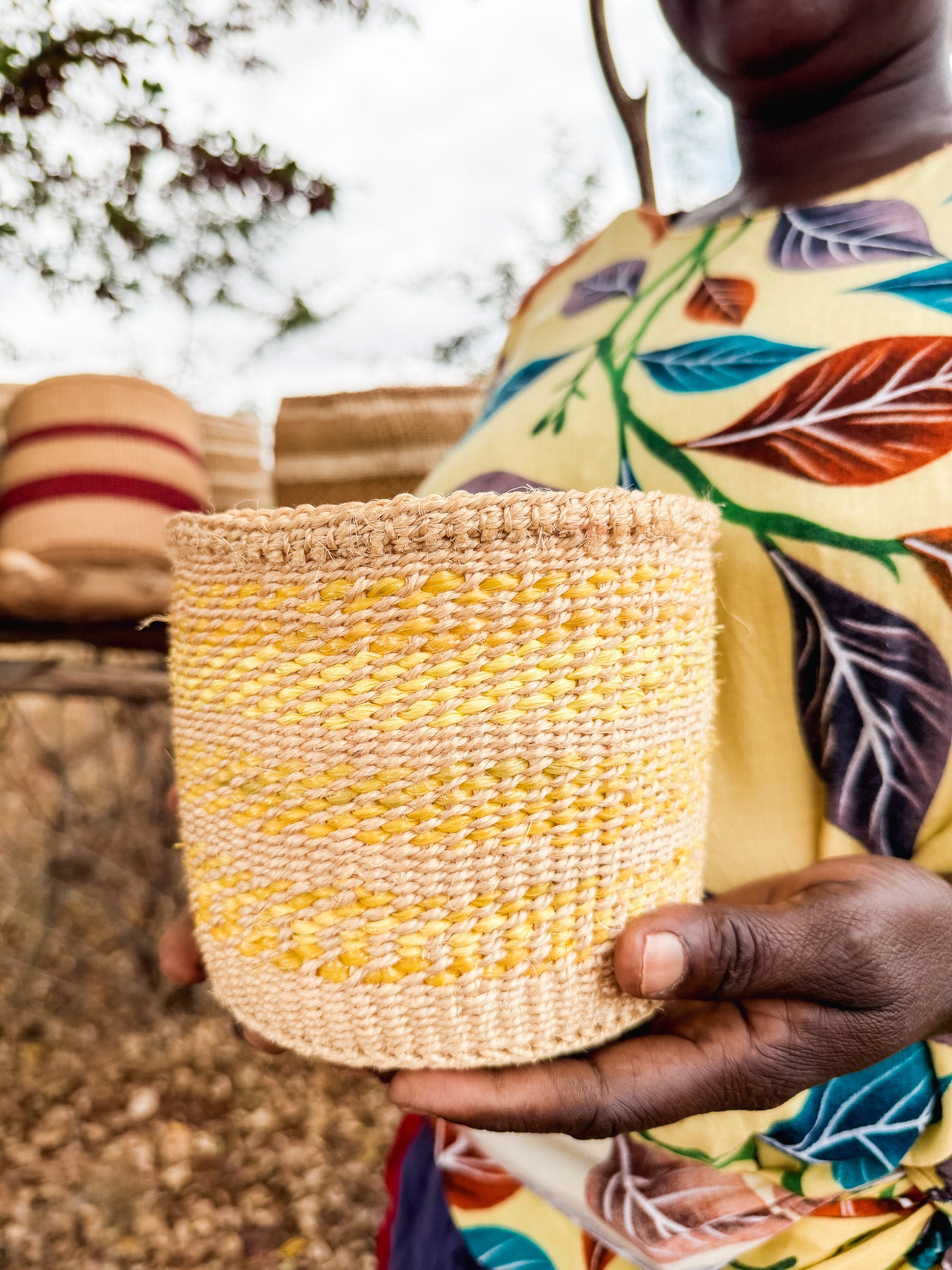 Hadithi thick weave sisal basket with sturdy handles, showcasing a natural textured surface and a spacious interior for storage.