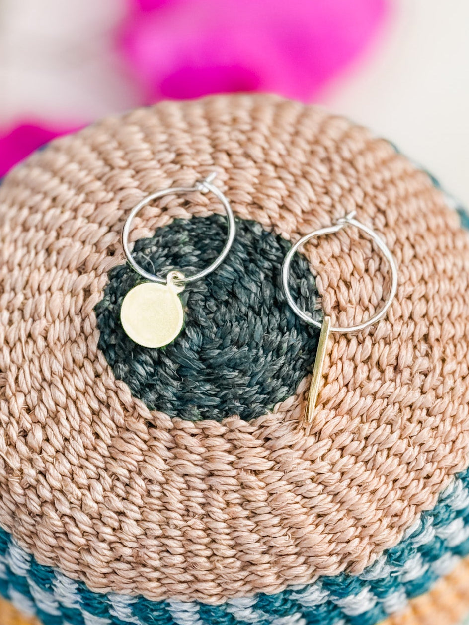 Charm earrings on silver hoops