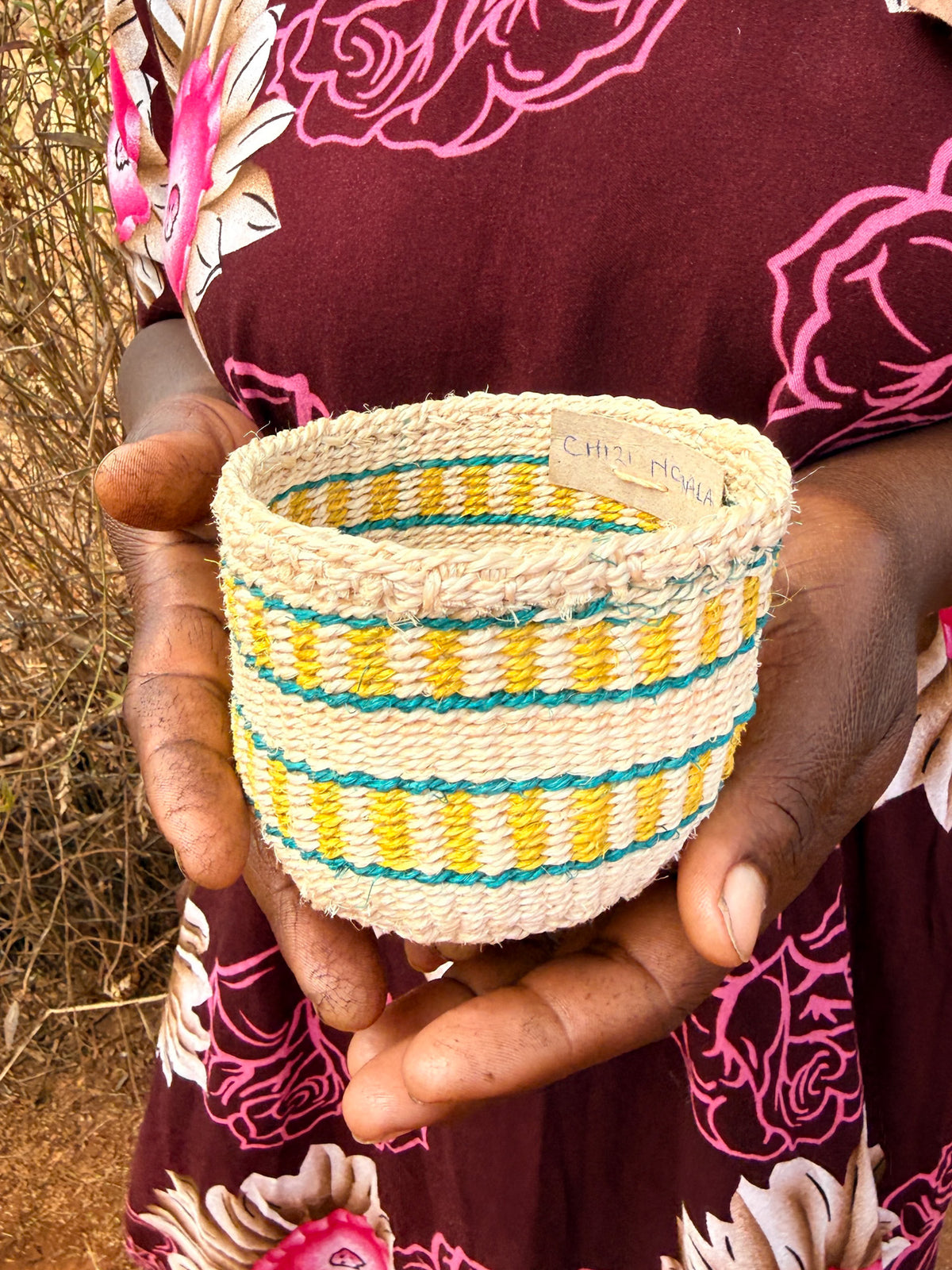 Mini sisal basket by Zawadisha, a small woven basket with a natural texture, perfect for storage or decoration.