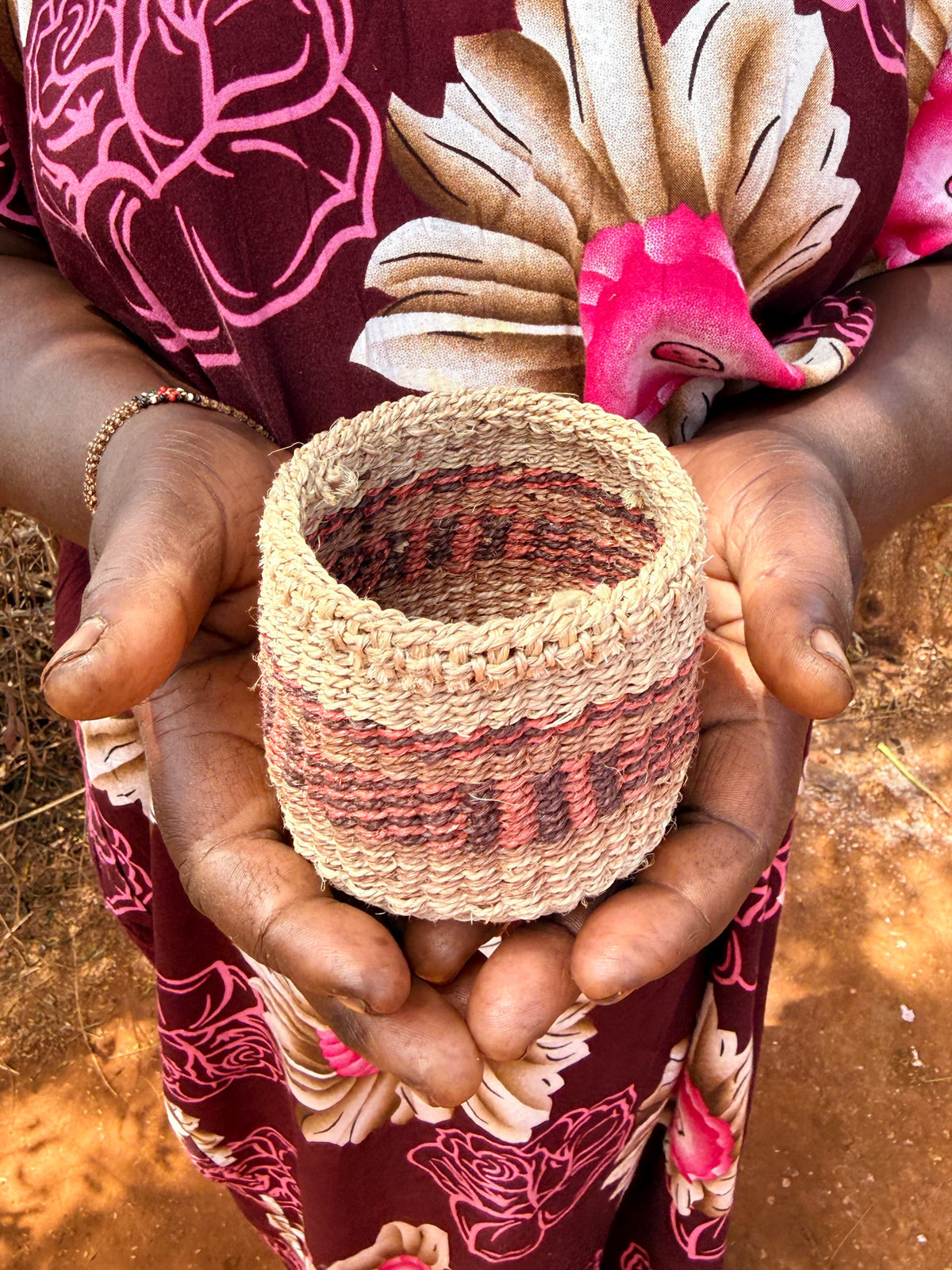 Mini sisal basket by Zawadisha with a woven texture and sturdy handle, ideal for storage or decorative use.