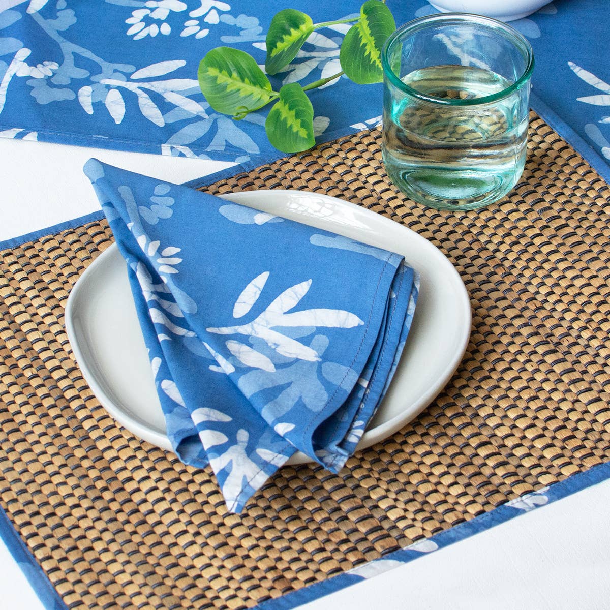 Organic Batik Napkin by Global Mamas featuring vibrant, hand-dyed batik fabric with intricate patterns on soft cotton fabric.