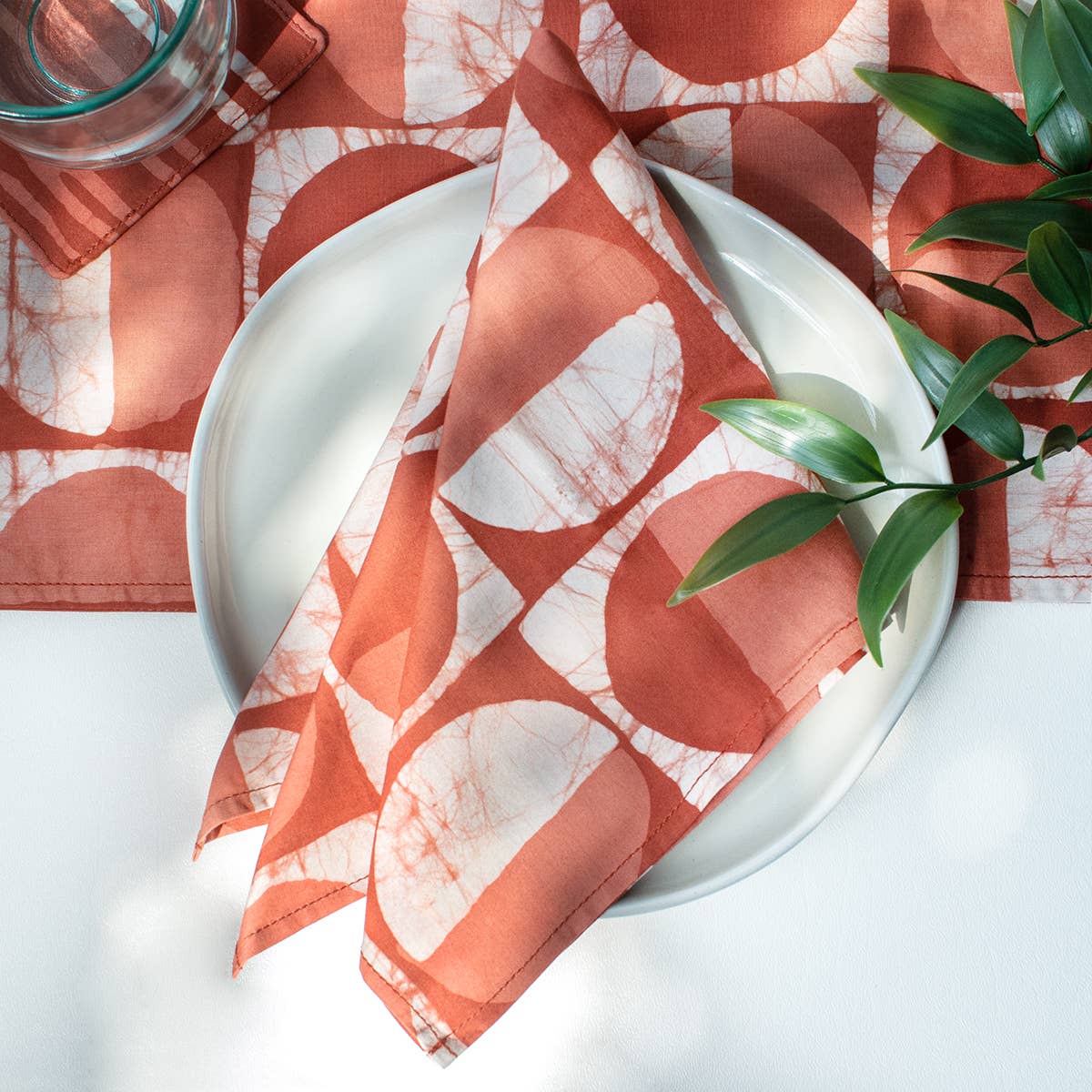 Organic Batik Napkins with modern circle patterns from Global Mamas, showcasing vibrant, handcrafted fabric design.